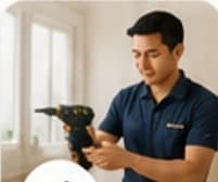 Technician using a drill for home maintenance